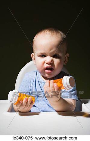 Baby with bottles of tablets View Large Photo Image Stock Photography - Baby with bottles of tablets. Fotosearch