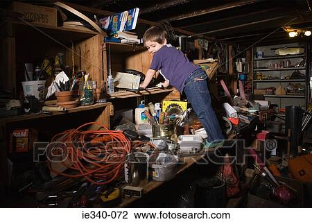 Boy climbing shelves View Large Photo Image Stock Image - Boy climbing shelves. Fotosearch