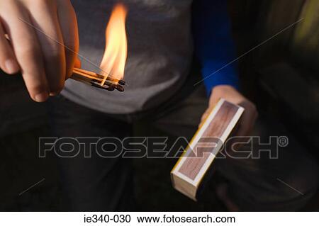 Boy playing with fire View Large Photo Image Stock Image - Boy playing with fire. Fotosearch