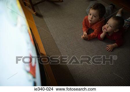 Boys watching television View Large Photo Image Picture - Boys watching television. Fotosearch