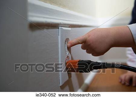Child poking electrical plug View Large Photo Image Stock Image - Child poking electrical plug. Fotosearch