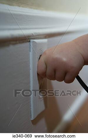 Stock Photo - Child pulling plug. Fotosearch