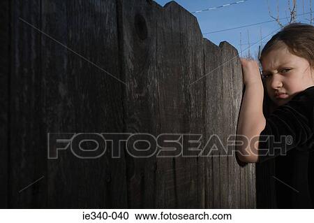 Girl climbing fence View Large Photo Image Stock Image - Girl climbing fence. Fotosearch