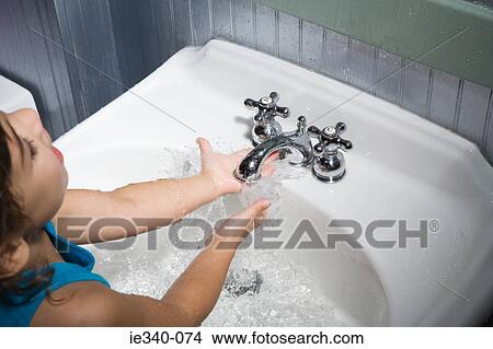 Girl splashing water View Large Photo Image Picture - Girl splashing water. Fotosearch