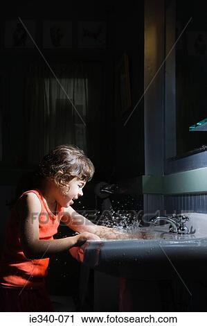 Girl splashing water View Large Photo Image Stock Image - Girl splashing water. Fotosearch