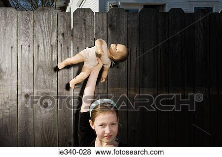 Stock Photo - Girl with doll. Fotosearch