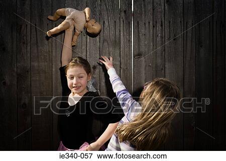 Girls fighting over doll View Large Photo Image Stock Photo - Girls fighting over doll. Fotosearch