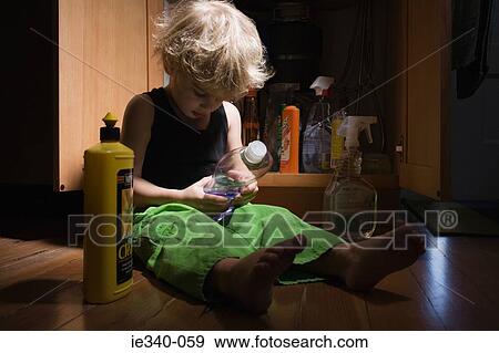 Little boy with cleaning products View Large Photo Image Stock Photo - Little boy with cleaning products. Fotosearch