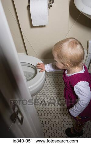 Little girl by toilet View Large Photo Image Stock Image - Little girl by toilet. Fotosearch