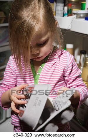 Little girl with egg carton View Large Photo Image Stock Photo - Little girl with egg carton. Fotosearch