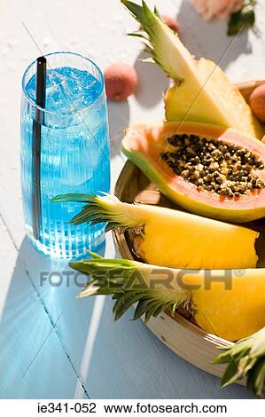 Blue haze cocktail and fruit View Large Photo Image Stock Image - Blue haze cocktail and fruit. Fotosearch
