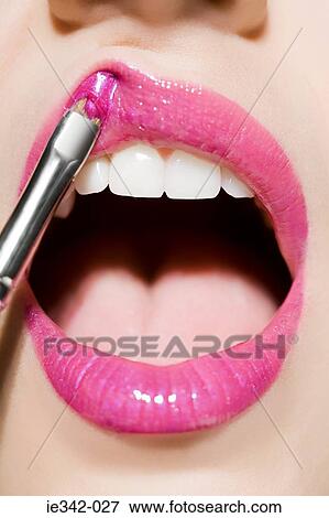 Applying lipgloss View Large Photo Image Stock Photo - Applying lipgloss. Fotosearch