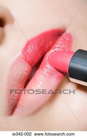 Applying lipstick View Large Photo Image Stock Image - Applying lipstick. Fotosearch