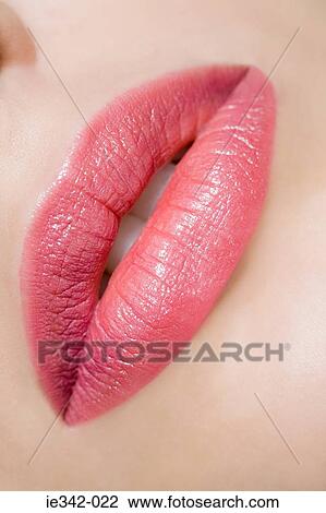 Stock Image - Close up of womans lips. Fotosearch