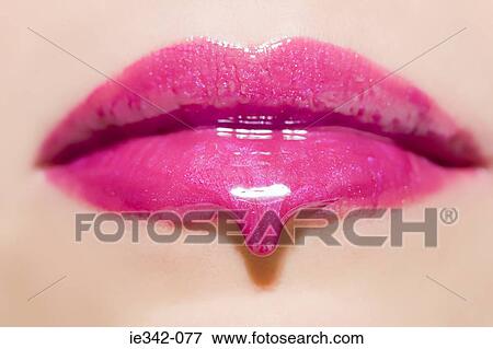 Lipgloss dripping from womans lips View Large Photo Image Stock Photo - Lipgloss dripping from womans lips. Fotosearch