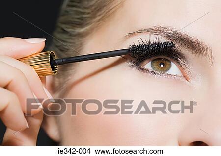 Woman applying mascara View Large Photo Image Picture - Woman applying mascara. Fotosearch
