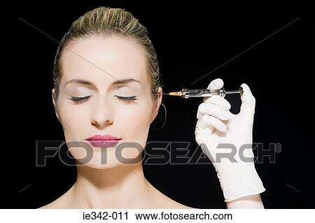 Woman having neurotoxin injection View Large Photo Image Stock Image - Woman having neurotoxin injection. Fotosearch