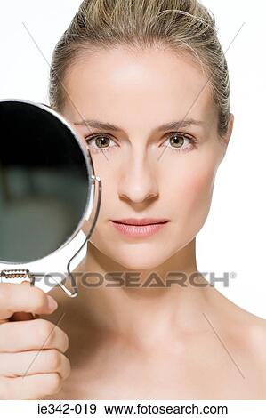Woman holding mirror View Large Photo Image Stock Photo - Woman holding mirror. Fotosearch
