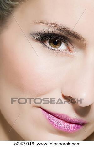 Woman wearing makeup View Large Photo Image Stock Photograph - Woman wearing makeup. Fotosearch