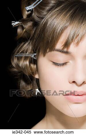 Woman with clips in her hair View Large Photo Image Stock Photography - Woman with clips in her hair. Fotosearch