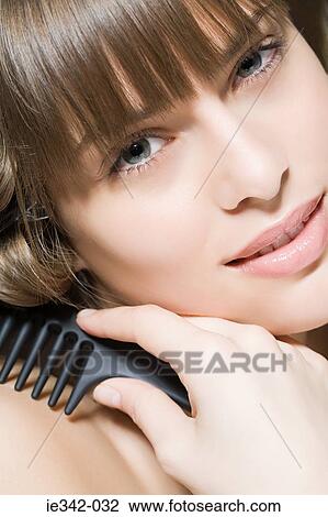 Woman with comb View Large Photo Image Stock Image - Woman with comb. Fotosearch