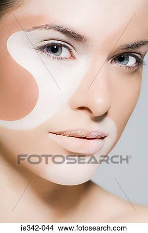 Woman with different colours on her face View Large Photo Image Picture - Woman with different colours on her face. Fotosearch