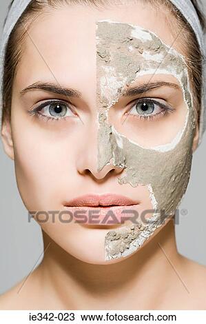 Woman with face mask on half of her face View Large Photo Image Stock Image - Woman with face mask on half of her face. Fotosearch