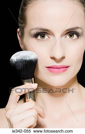 Woman with face powder View Large Photo Image Stock Photography - Woman with face powder. Fotosearch