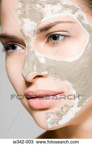 Woman with mask on her face View Large Photo Image Stock Image - Woman with mask on her face. Fotosearch