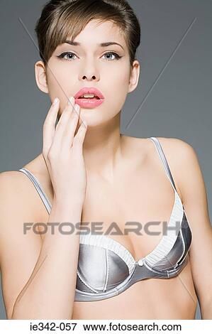 Young woman in bra View Large Photo Image Stock Photo - Young woman in bra. Fotosearch