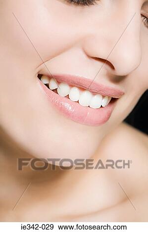 Young woman smiling View Large Photo Image Stock Photo - Young woman smiling. Fotosearch