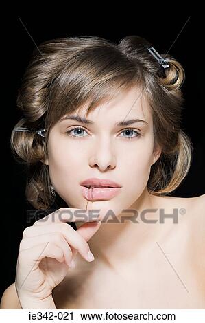 Young woman with hair pin View Large Photo Image Stock Image - Young woman with hair pin. Fotosearch