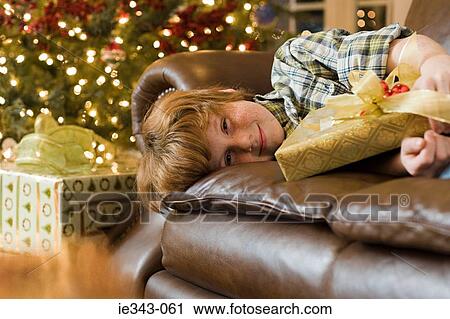 Boy with a christmas gift View Large Photo Image Stock Image - Boy with a christmas gift. Fotosearch