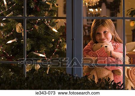 Stock Image - Girl at christmas. Fotosearch