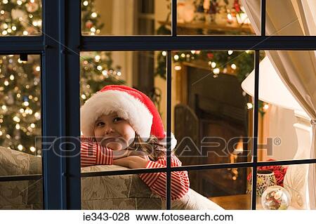 Girl at christmas View Large Photo Image Stock Photo - Girl at christmas. Fotosearch