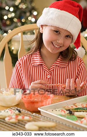 Girl making christmas cookies View Large Photo Image Stock Image - Girl making christmas cookies. Fotosearch