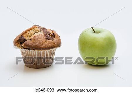 A muffin and an apple View Large Photo Image Stock Image - A muffin and an apple. Fotosearch