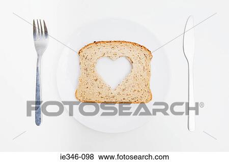 A slice of bread with a heart in it View Large Photo Image Stock Photo - A slice of bread with a heart in it. Fotosearch