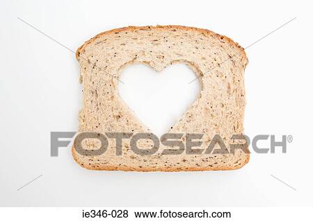 A slice of bread with a heart shape on it View Large Photo Image Stock Photo - A slice of bread with a heart shape on it. Fotosearch