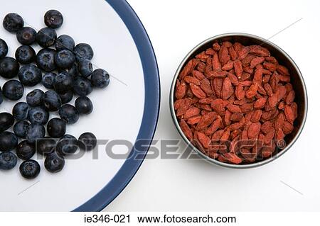 Stock Image - Blueberries and dried goji berries. Fotosearch