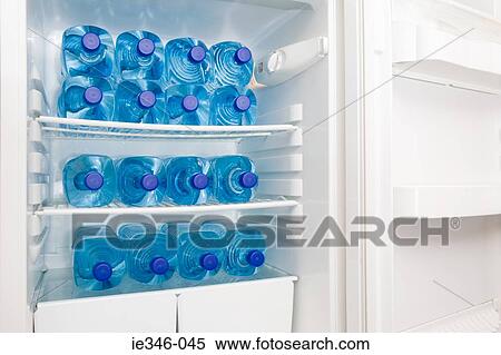 Bottles of water in a fridge View Large Photo Image Stock Photography - Bottles of water in a fridge. Fotosearch