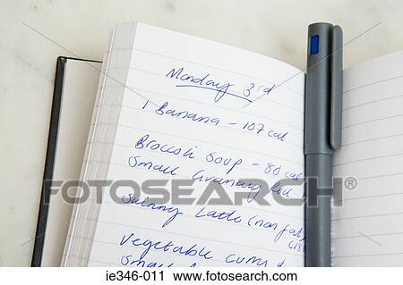 Stock Image - Food diary and pen. Fotosearch