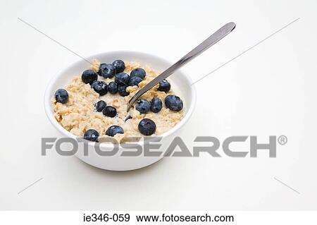 Porridge and blueberries View Large Photo Image Stock Photo - Porridge and blueberries. Fotosearch