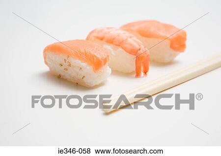 Sushi and chopsticks View Large Photo Image Stock Photo - Sushi and chopsticks. Fotosearch