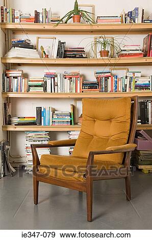 Chair and bookshelf View Large Photo Image Stock Photo - Chair and bookshelf. Fotosearch