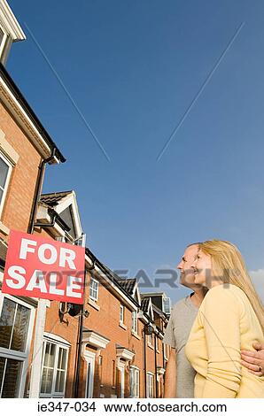 Couple looking at house for sale View Large Photo Image Picture - Couple looking at house for sale. Fotosearch