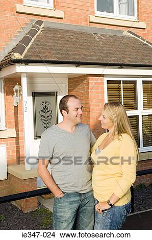 Couple outside house View Large Photo Image Picture - Couple outside house. Fotosearch
