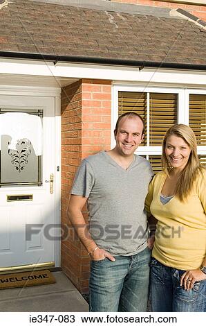 Couple outside house View Large Photo Image Stock Image - Couple outside house. Fotosearch