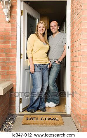 Couple standing in doorway View Large Photo Image Stock Image - Couple standing in doorway. Fotosearch