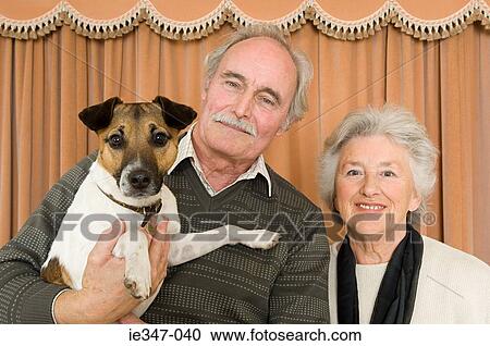 Couple with their pet dog View Large Photo Image Stock Image - Couple with their pet dog. Fotosearch